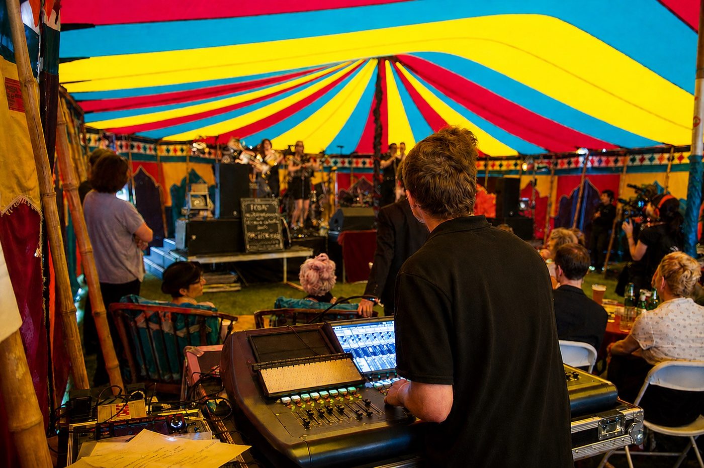 Sound engineer at mixing desk during a live festival performance