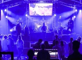 Worship production with full band, lighting rig and LED screen